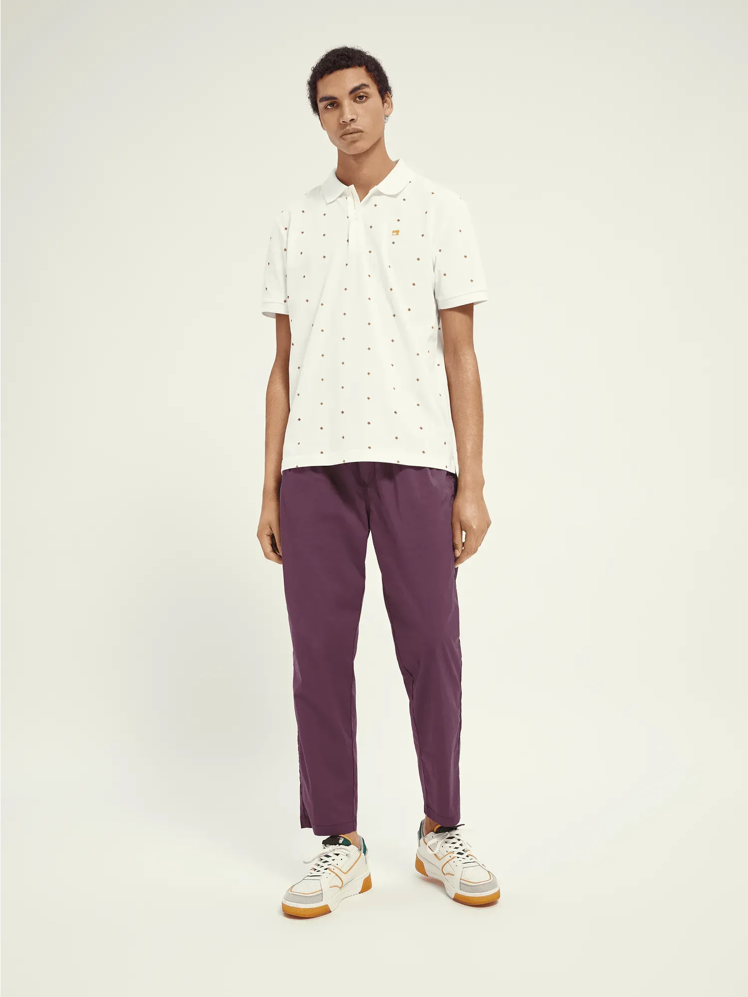 Polo de piqué de algodón orgánico con diseño estampado
