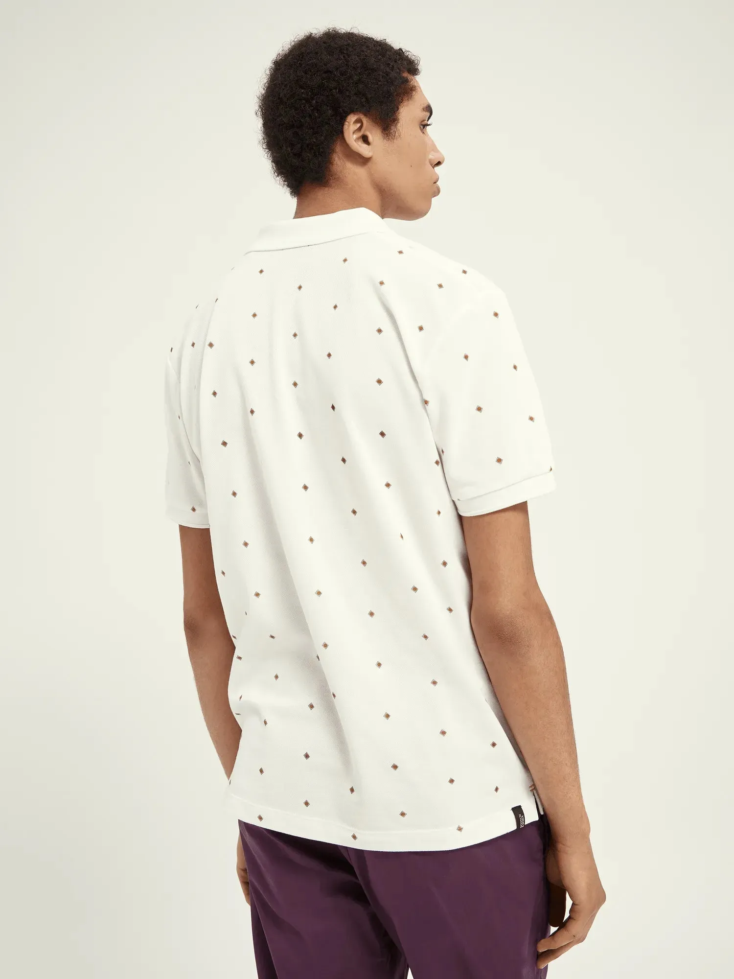 Polo de piqué de algodón orgánico con diseño estampado