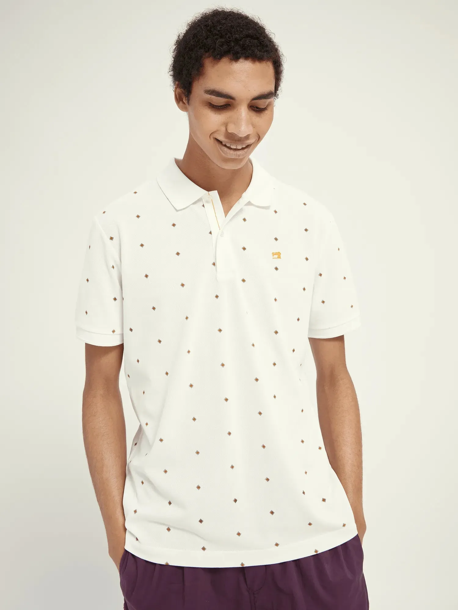 Polo de piqué de algodón orgánico con diseño estampado